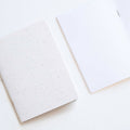 Tom's Studio x Coffeenotes A6 Notebook in 'Grounds' white, with plain pages, made from recycled coffee cups and eco-friendly materials.