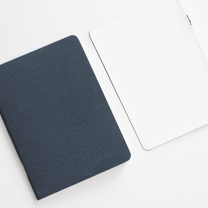 Tom's Studio x Coffeenotes A6 Notebook in Black, with dotted pages, made from recycled coffee cups and eco-friendly materials.