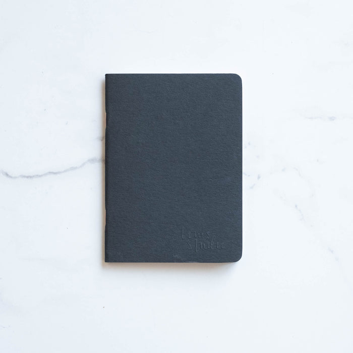 Tom's Studio x Coffeenotes A6 Notebook in Black, made from recycled coffee cups and eco-friendly materials.