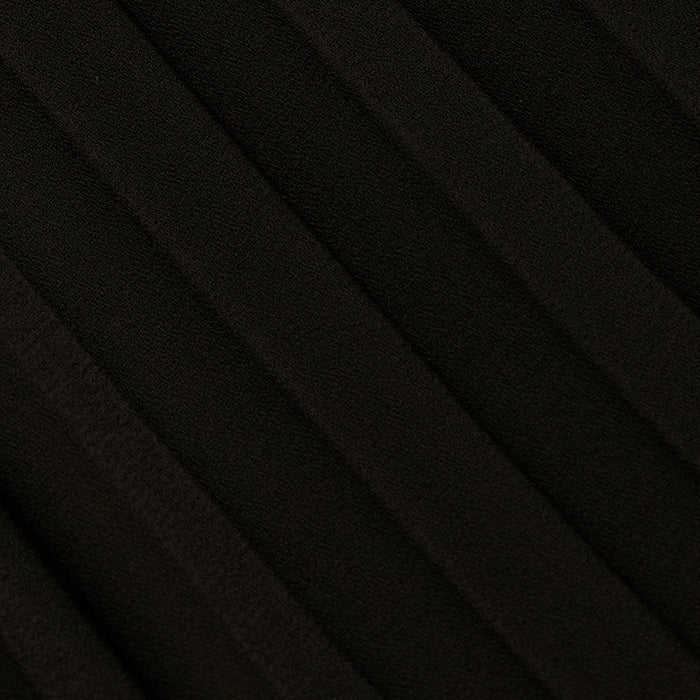 Close-up of the Adalynn Cover-Up Dress in black, featuring textured fabric with diagonal, evenly spaced ridges that create a pleated pattern across the surface—reminiscent of the delicate detail often found in a black lace dress.
