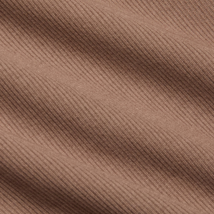 Close-up of the Adira Scoopneck Tank in brown, featuring stretch rib fabric with diagonal textured lines and soft shadows that highlight the material’s weave and surface detail.
