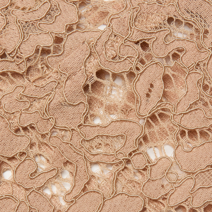 Close-up of the Aislin Lace Bralette featuring beige sheer stretch lace with intricate, swirling patterns and textured embroidery, subtly revealing the white lining beneath through its open design.