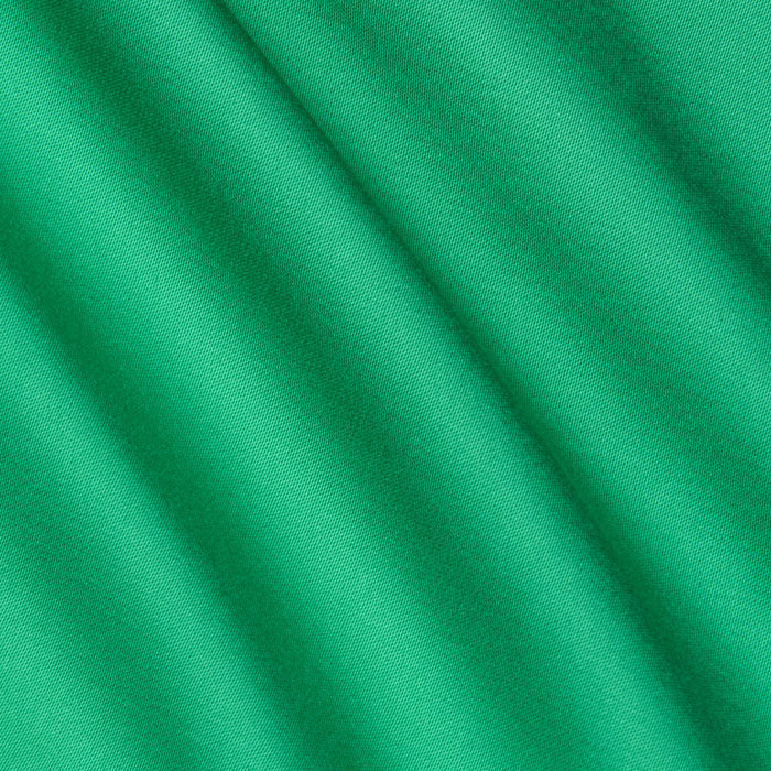 Close-up of smooth island green Akiya Satin Maxi Dress fabric with soft diagonal folds and gentle shadows, creating a subtle striped texture across the surface.