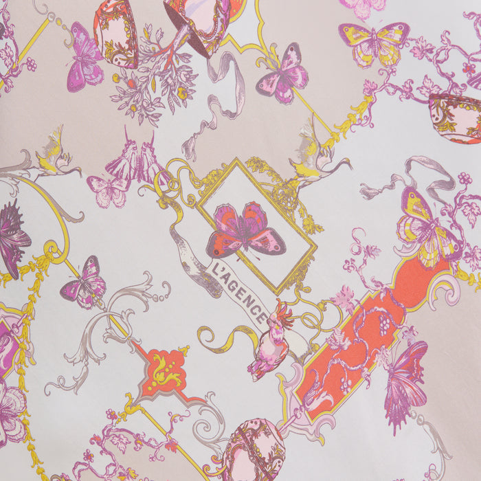 Colorful scarf pattern featuring pink, purple, and orange butterflies, ornate frames, floral accents, and the word LAGENCE at the center on a pale background serves as the perfect inspiration for the Akiya Satin Maxi Dress—a stunning option for day-to-night wear.