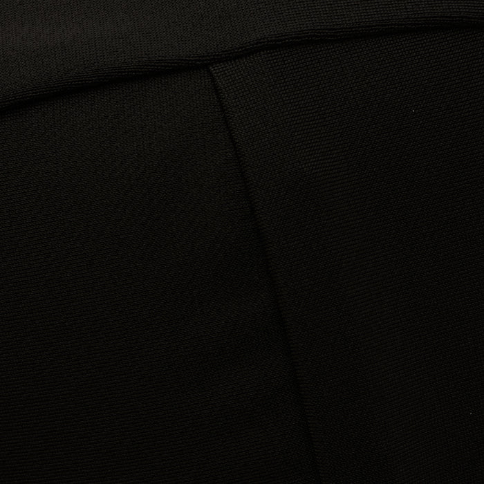 Close-up of the Alexandria Bikini Top in black, showcasing its textured fabric with a visible diagonal seam and a fold near the top of the image.