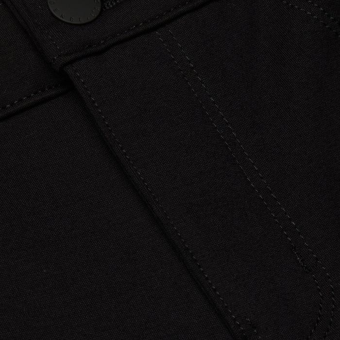 Close-up of the Amaris Pedal Pusher in black denim, highlighting a stitched seam, partial pocket detail, and a black button at the top—crafted for a body-hugging fit.