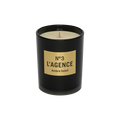 The Ambre Soleil black candle jar, labeled No. 3, showcases beige soy-blend wax with a centered wick, all set against a plain white background.