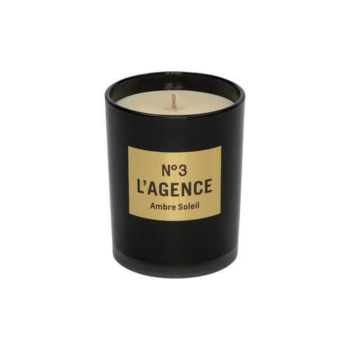 The Ambre Soleil black candle jar, labeled No. 3, showcases beige soy-blend wax with a centered wick, all set against a plain white background.