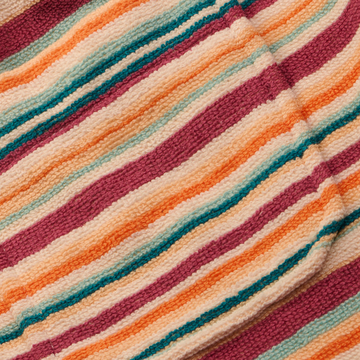 Close-up of the Amiya Cover-Up Short, showcasing its textured fabric with horizontal stripes in shades of orange, pink, cream, and teal. The soft, subtly ribbed material evokes the comfort of cozy terrycloth—perfect for poolside lounging.