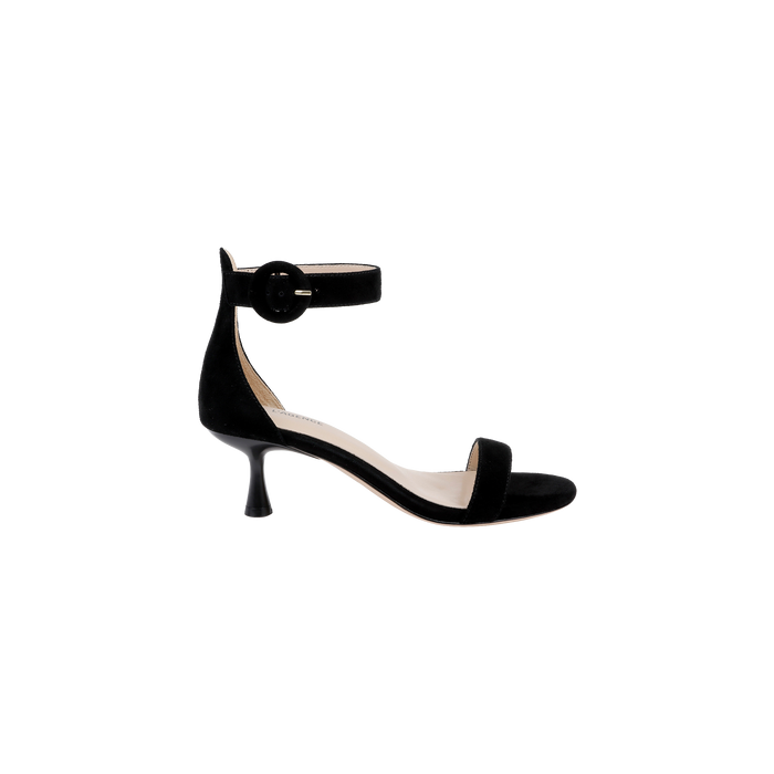 The Andelle Kitten-Heel Sandal is a black suede sandal featuring an open toe, low flared kitten heel, ankle strap with a large round buckle, and a comfortable memory foam insole, shown against a plain white background.