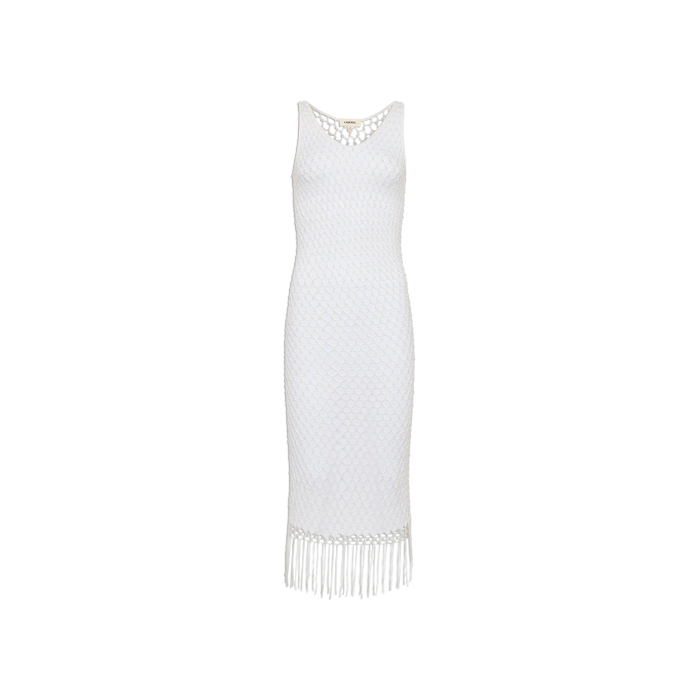 The Angela Crochet Cover-Up Dress is a sleeveless white dress with a fitted silhouette, showcasing a diamond-patterned crochet texture and a fringe hem. It features a scoop neckline and falls to mid-calf length.