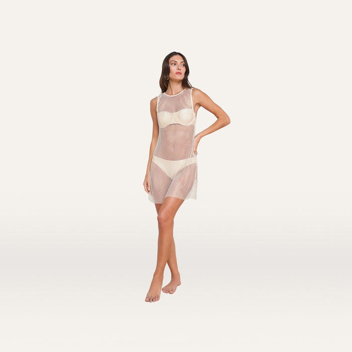 A woman stands posed against a plain, light background, wearing the Angela Mesh Cover-Up Dress over a matching bra and underwear set.