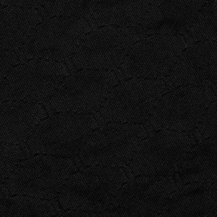 Close-up of the Annabelle Bikini Top crafted from dark black fabric with a subtle, woven geometric pattern and a slightly textured surface—perfect for UPF 50 swimwear or a chic black triangle bikini with an adjustable fit.