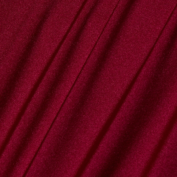 Close-up of deep red fabric with diagonal folds and a smooth, slightly shiny texture, characteristic of the Annabelle Triangle Bikini Top.