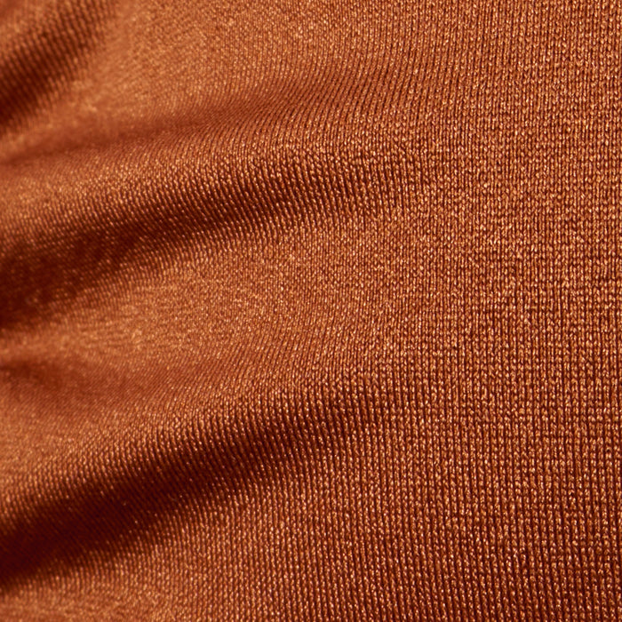 Close-up of brown, textured fabric with visible weave pattern and slight wrinkles on the Annabelle Triangle Bikini Top, creating a sense of depth and softness—perfect for an adjustable fit or luxe hardware details.
