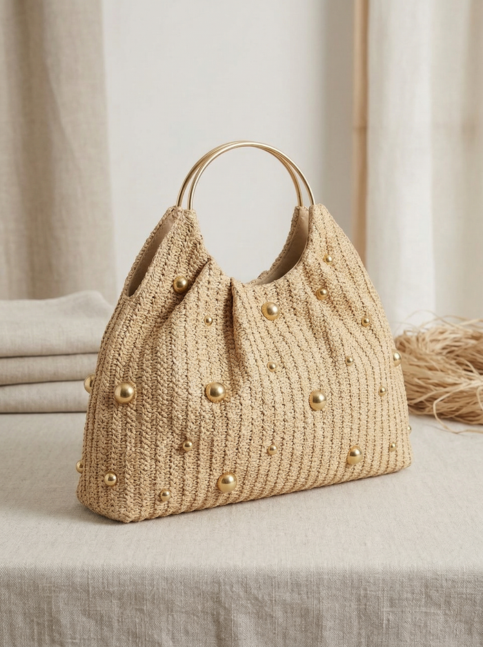Artisanal Studded Handwoven Raffia Bag with Sculptural Gold Ring Handle LINTICO