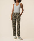Olive floral print relaxed leg pants with front pockets and straight leg silhouette.