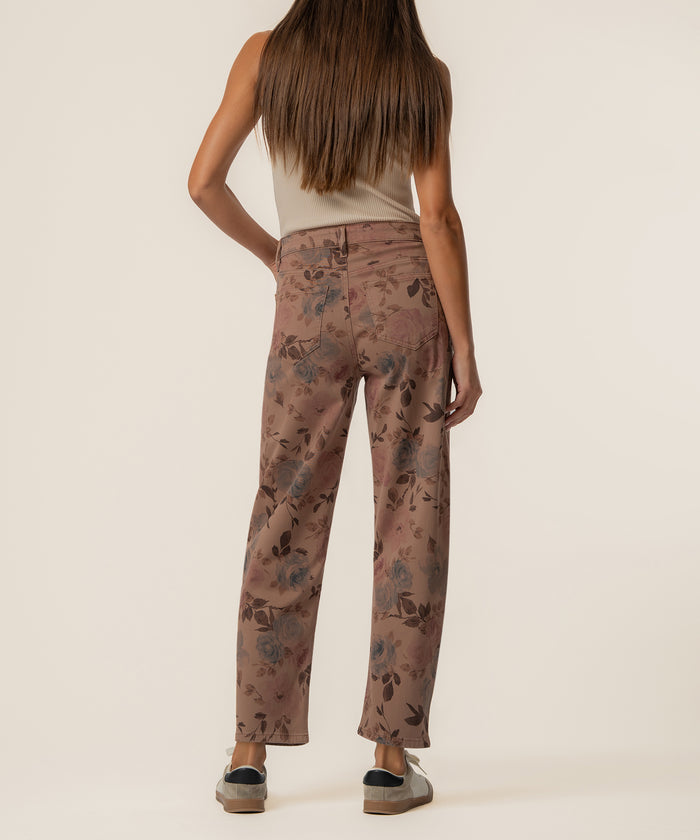 Mauve twill pants with floral print, high rise and relaxed leg fit, shown from back.