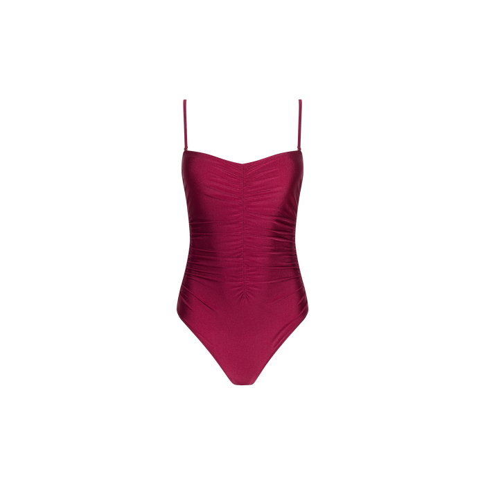 The Aubrey Ruched One-Piece Swimsuit, shown against a plain white background, is crafted from four-way stretch nylon in burgundy and features thin spaghetti straps along with textured shirring down the front.
