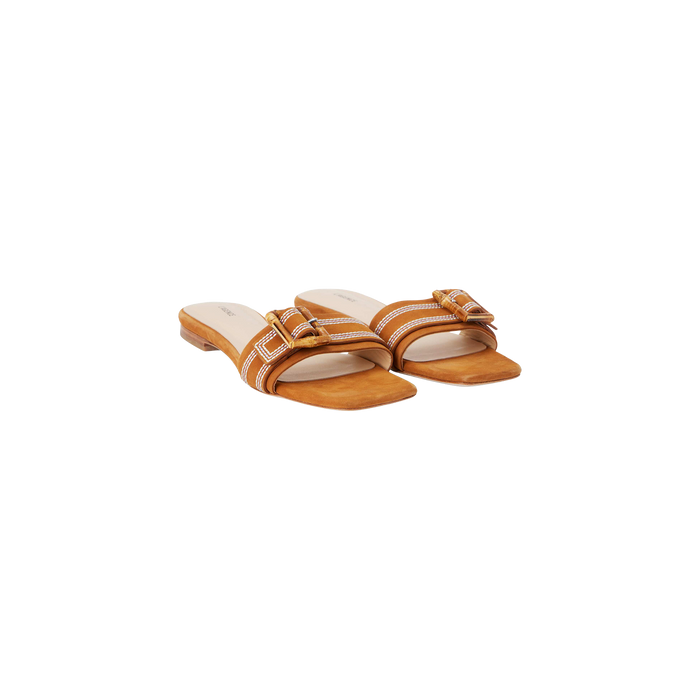 The Aurelie Buckle Sandal is a pair of tan square-toed sandals featuring brown straps and gold bamboo buckles, displayed on a plain white background.