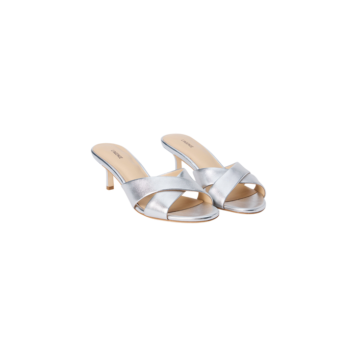 Aveline Kitten-Heel Sandal: a pair of silver, open-toe heeled sandals featuring a strappy vamp and slim kitten heels crafted from metallic leather, displayed on a white background.