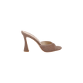 Avery Suede Open-Toe Mule in taupe suede, featuring a high sculpted, curved stiletto heel and open toe design, displayed in side profile against a white background.