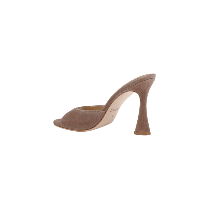 The Avery Suede Open-Toe Mule, featuring a taupe suede finish, an open toe, and a sculpted high heel, is shown in a side view against a white background.