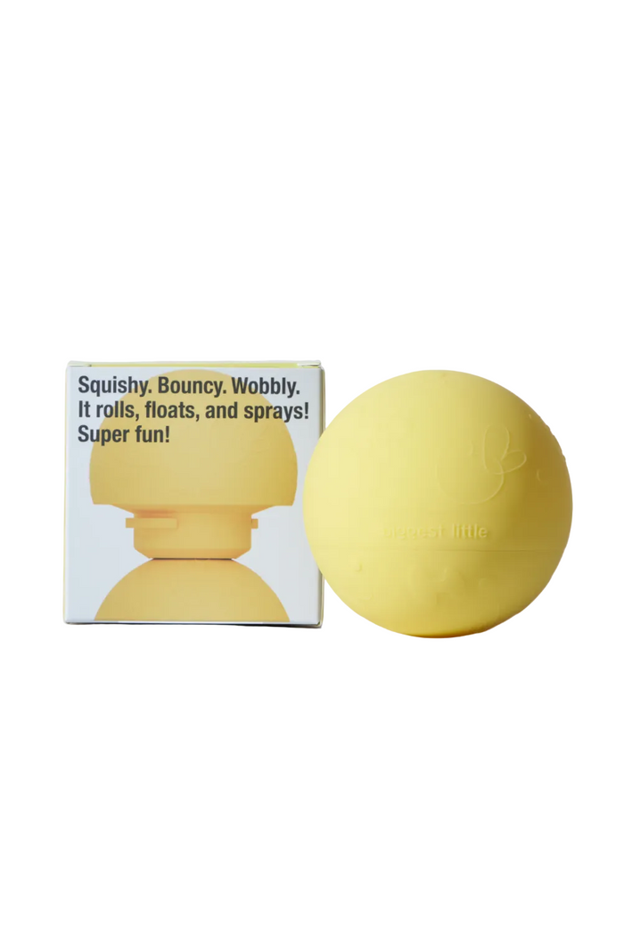Yellow ball with packaging on a white background