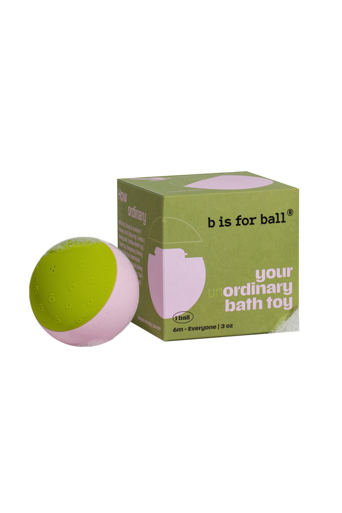 Green and pink ball with packaging labeled 'b is for ball' on a white background