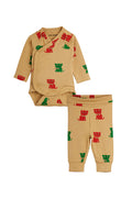 A two-piece baby outfit set featuring a tan long-sleeve wrap bodysuit and matching pants, both printed with a pattern of small red and green kitten silhouettes, shown on a plain white background.