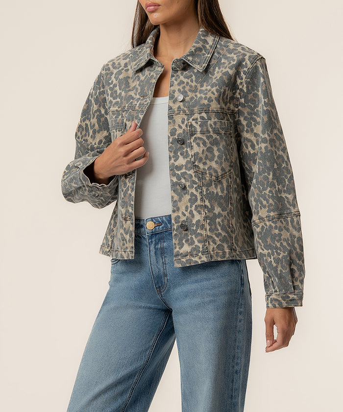 Leopard-print denim jacket in tan and brown with button front and collared neckline.