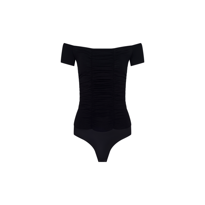 The Baliegh Ruched Bodysuit is a black, off-the-shoulder piece made from rayon stretch jersey, showcasing short sleeves and allover front ruching, shown against a plain white background.