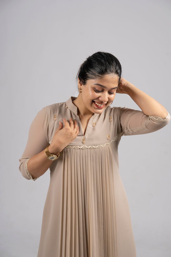 Beige shaded georgette A-line kurti with handworked yoke and lace detailing MBS-254