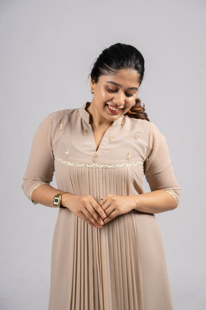 Beige shaded georgette A-line kurti with handworked yoke and lace detailing MBS-254
