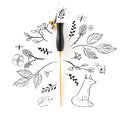 The Bloom calligraphy pen with oblique nib setting in Black on a background of illustrations in ink