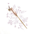 The Bloom calligraphy pen with oblique nib setting in Peony on a background of illustrations in ink