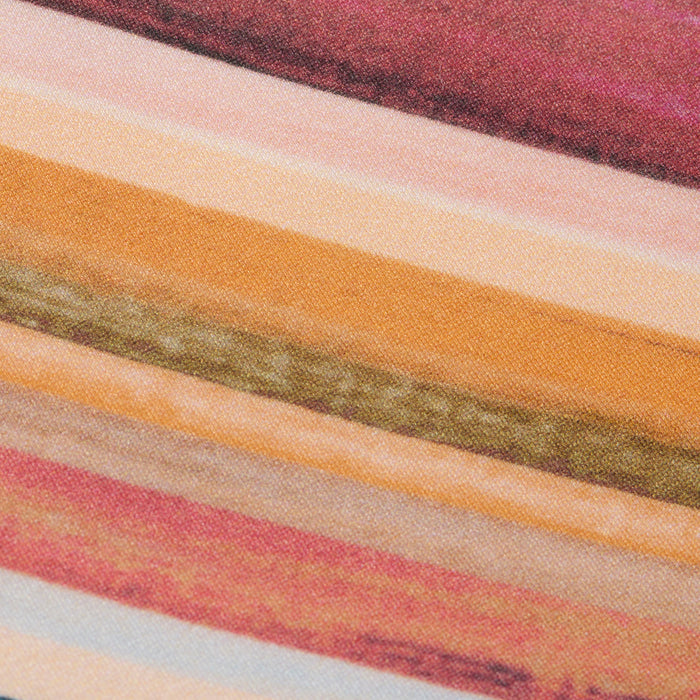 Close-up of the Britt Tie-Side Bikini Bottom, showcasing textured horizontal stripes in shades of red, pink, orange, yellow, green, and beige. Designed with adjustable tie sides and moderate coverage, the fabric has a painted or printed appearance.