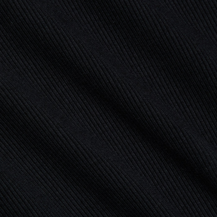 Close-up of the Brynlee Scoopneck Tee in black, crafted from stretch cotton ribbed fabric with diagonal textured lines that form a subtle striped pattern and offer a soft, slightly glossy finish.