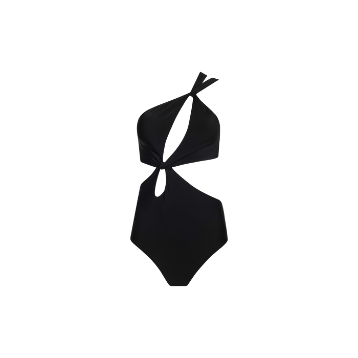 The Camilla Monokini is a black, one-shoulder swimsuit with an asymmetrical design, featuring two front cutouts and a single twisted strap that crosses over one shoulder.
