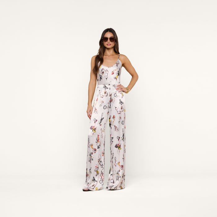 A woman wearing the Charmy Satin Camisole and sunglasses stands confidently against a plain white background.