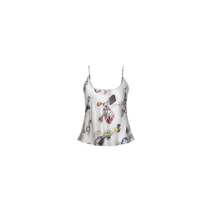 The Charmy Satin Camisole is crafted from white satin with thin straps and adorned with a colorful, whimsical butterfly print featuring flowers, perfume bottles, and a variety of illustrated accessories.