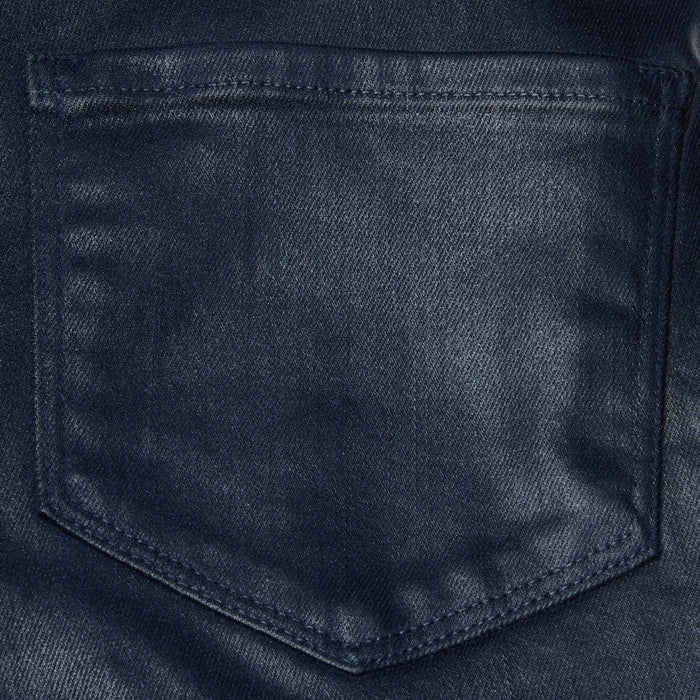 Close-up of the Clayton Coated Wide-Leg Jean in dark blue, highlighting the back pocket’s fabric texture and stitching details.
