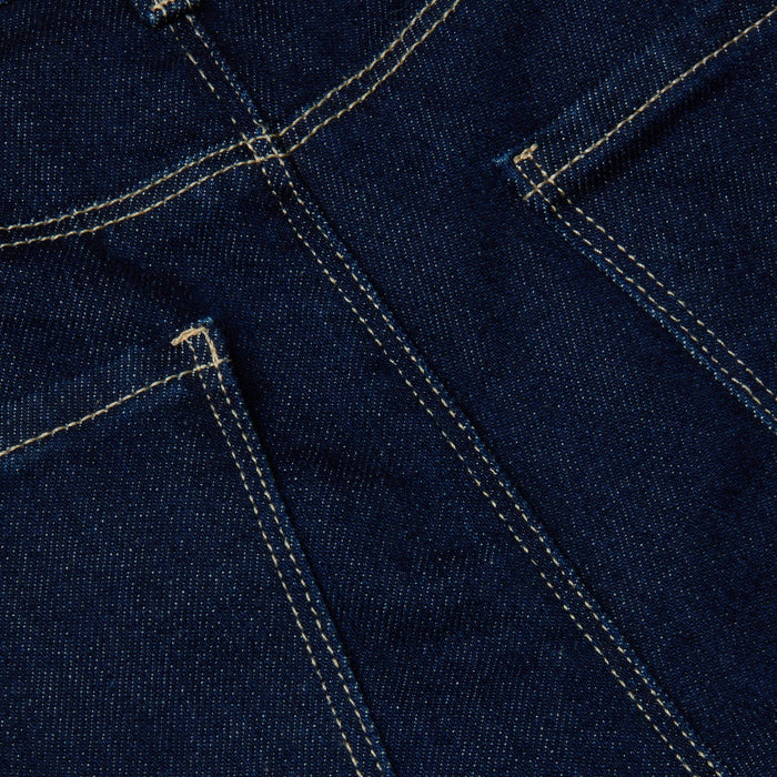 Close-up of the Clayton Wide-Leg Jean in dark wash denim, featuring two pockets and double-stitched yellow seams that showcase the fabric texture and construction details of this high-rise style.