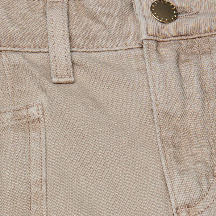 Close-up of the Cody Cropped Barrel-Leg Jean in beige, made from all-cotton denim, showing a front pocket, belt loop, waistband stitching, and a metal button.