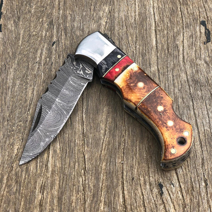 DAMASCUS POCKET KNIFE, HANDMADE FOLDING KNIFE, MADE OF BURNT CAMEL BONE cskforged