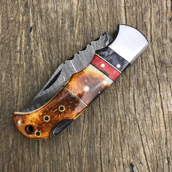 DAMASCUS POCKET KNIFE, HANDMADE FOLDING KNIFE, MADE OF BURNT CAMEL BONE cskforged