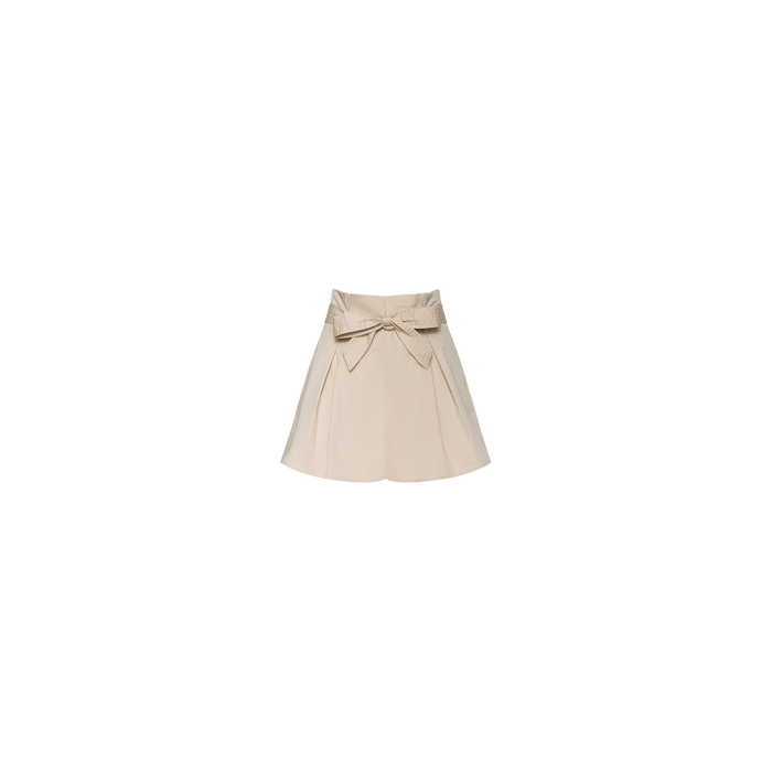 Damira Poplin Short in beige, designed with a high waist, wide waistband, and a prominent decorative bow at the front. This style features soft pleats and a flared silhouette inspired by stretch poplin shorts, shown against a plain white background.