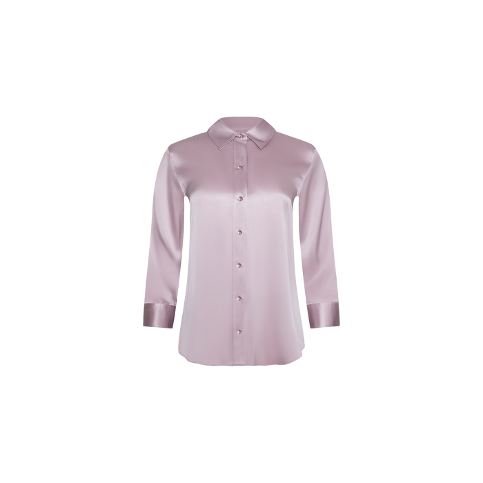 The Dani Silk Blouse, a long-sleeve, light pink button-down top with a classic collar and shiny finish, is displayed on a plain white background.