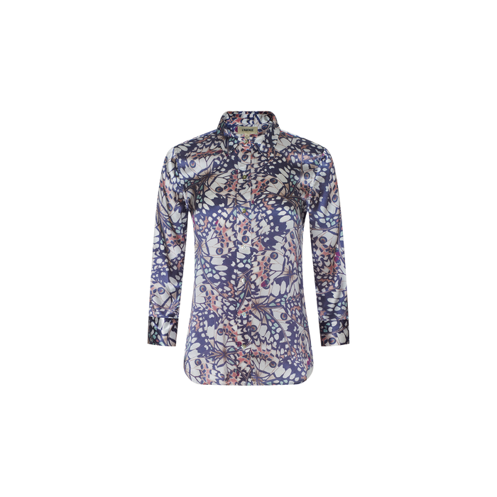 The Dani Silk Blouse is a long-sleeve button-down shirt made from silk, featuring a blue, white, and red floral and leaf pattern on a plain white background.