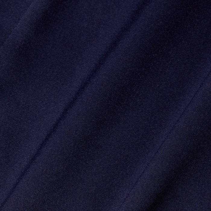 Close-up of the Dara Stretch-Satin Bodysuit in dark navy blue, featuring diagonal, slightly raised stripes that highlight its soft texture and subtle sheen—perfect for a bodysuit with adjustable straps.